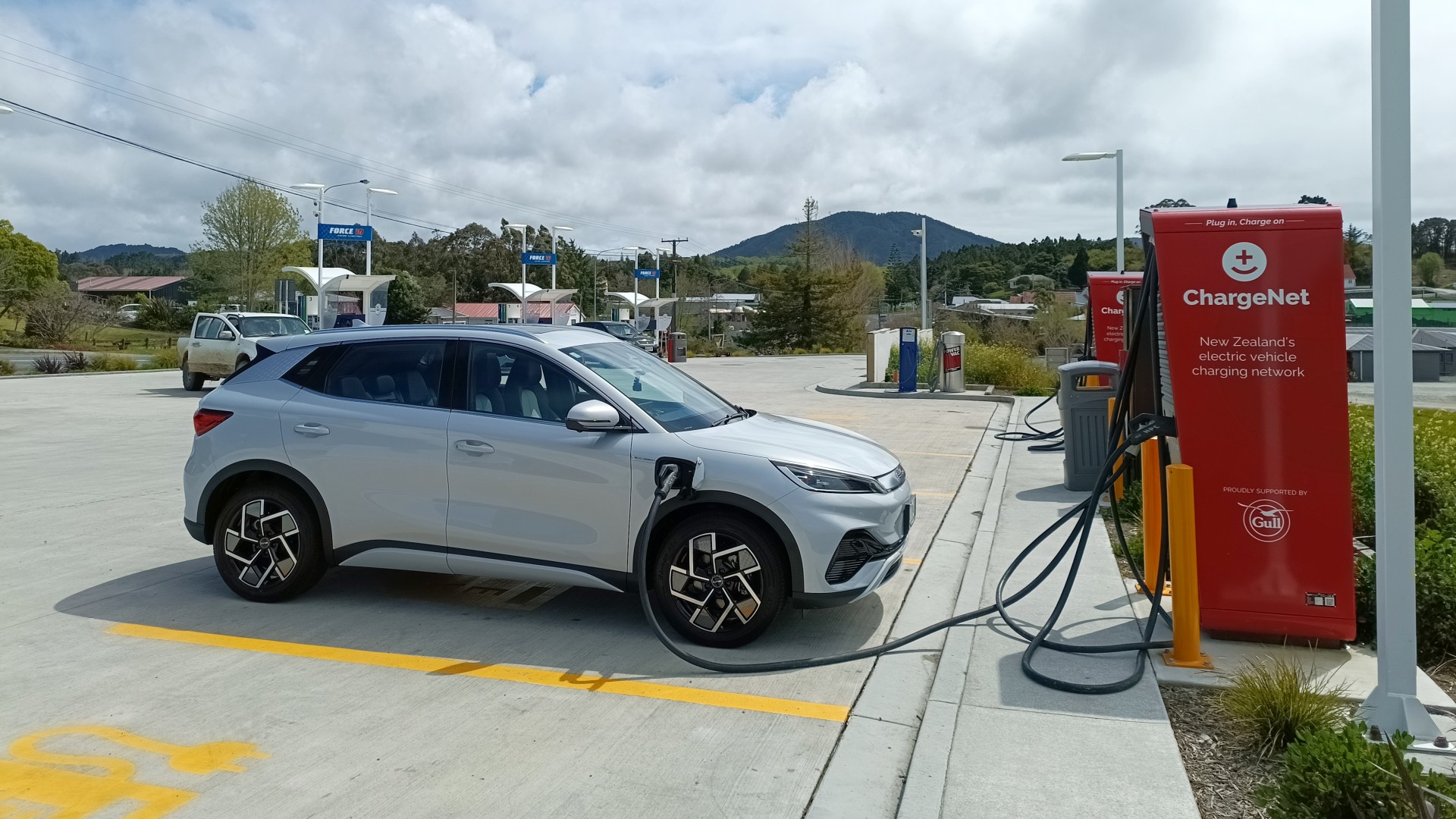 A BYD Atto 3 electric car stopped at a charging point in Kaiwaka, plugged in and recharging