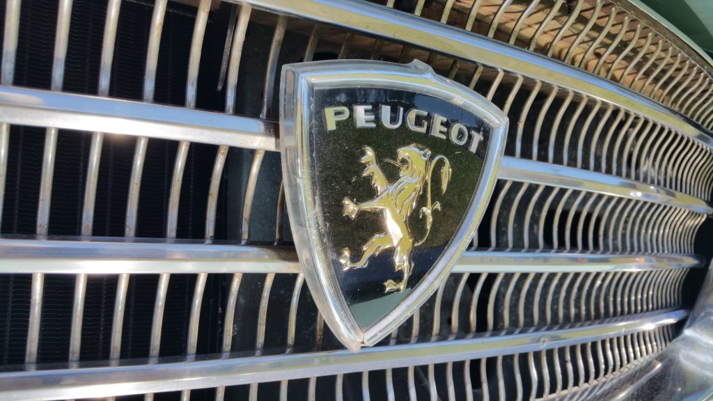 1970 Peugeot 404 badge on grille