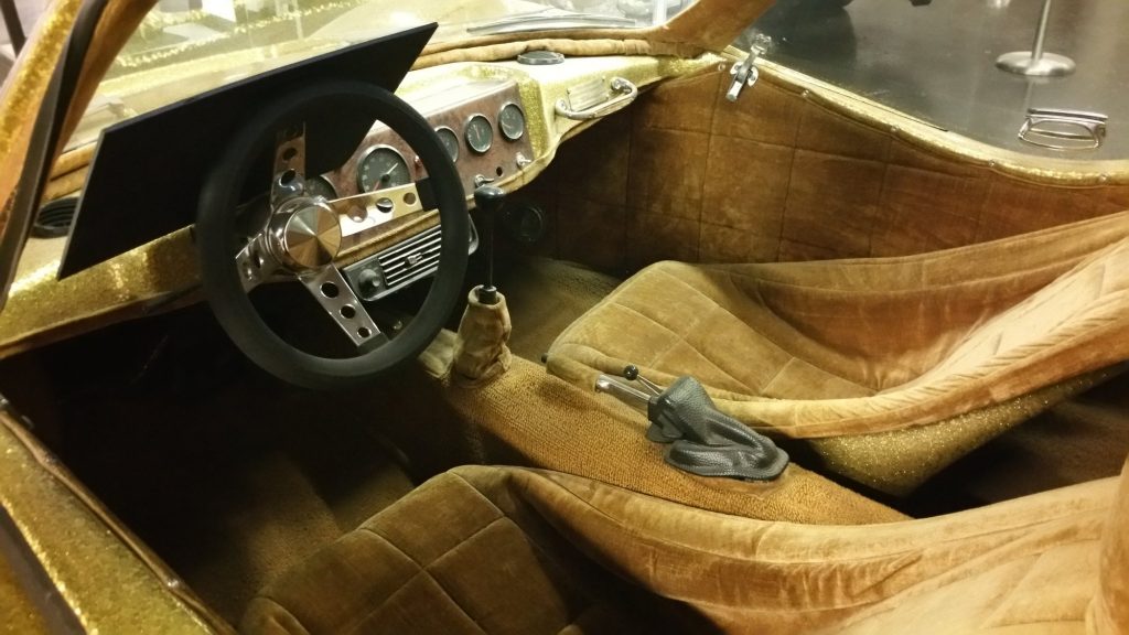 The interior of Liberace's 1972 Bradley GT with gold metal flake finish